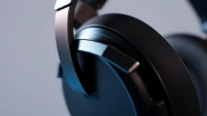 Close-up of premium gaming headset with metallic headband and memory foam ear cups, professional studio lighting, no visible text or branding